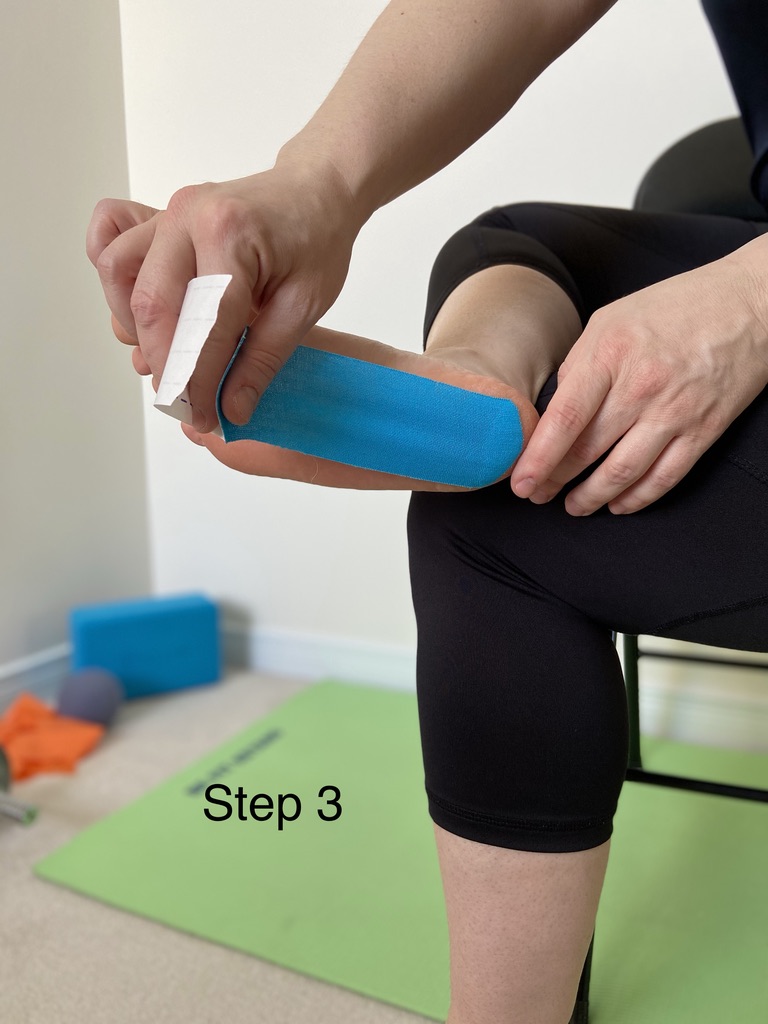 Anchoring the long strip of tape at the heel