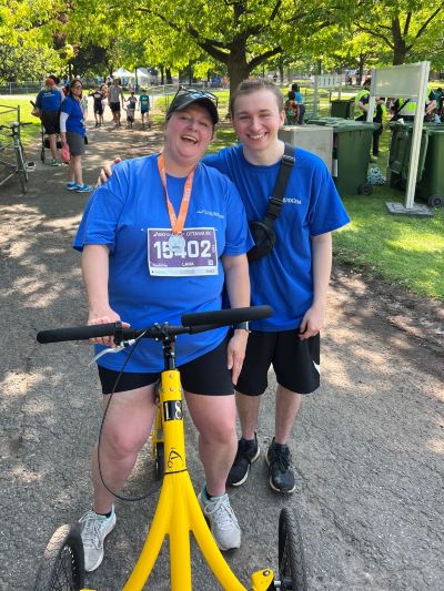 Two team members with their bibs and an Alinker