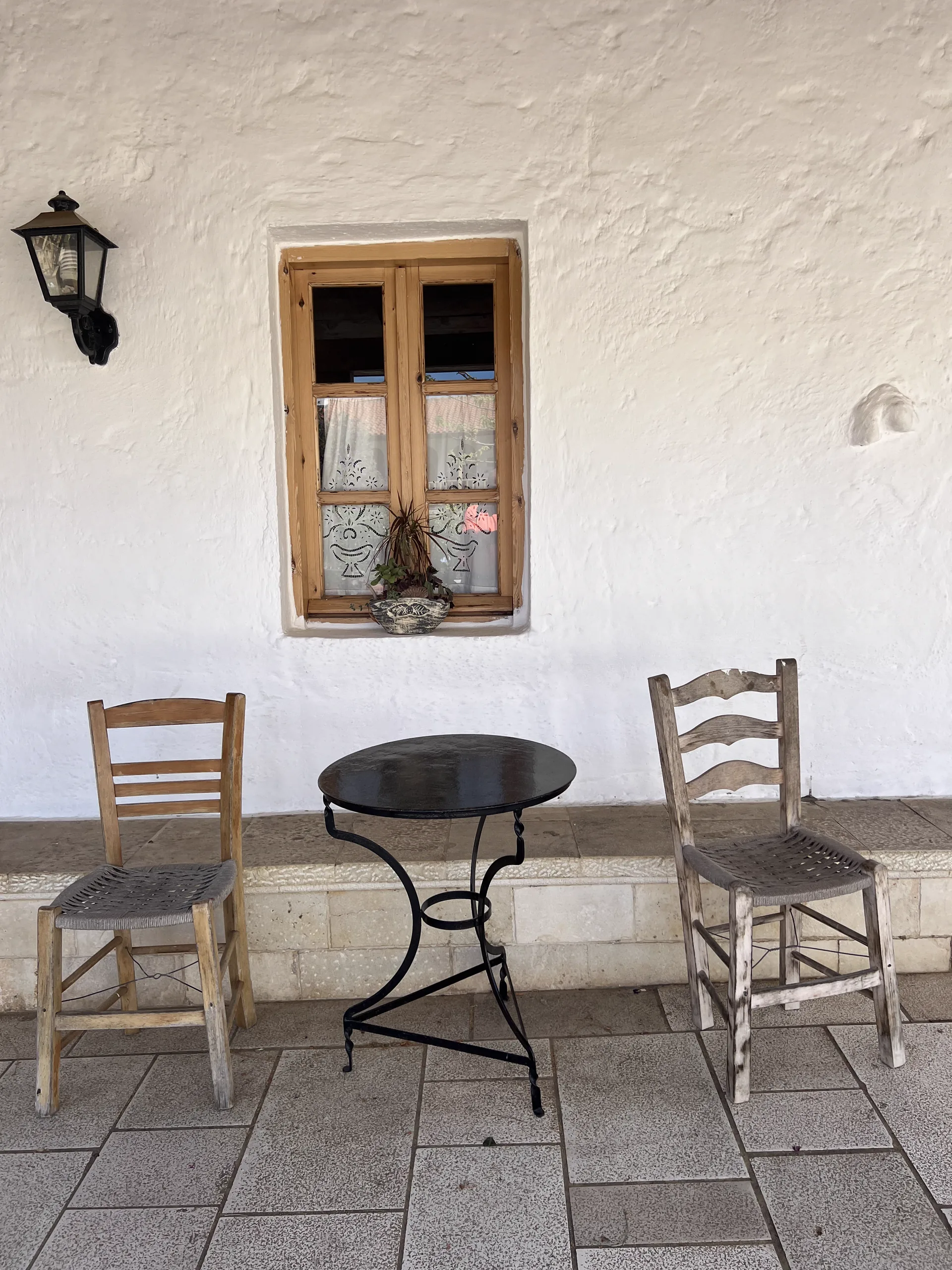Two chairs by a window