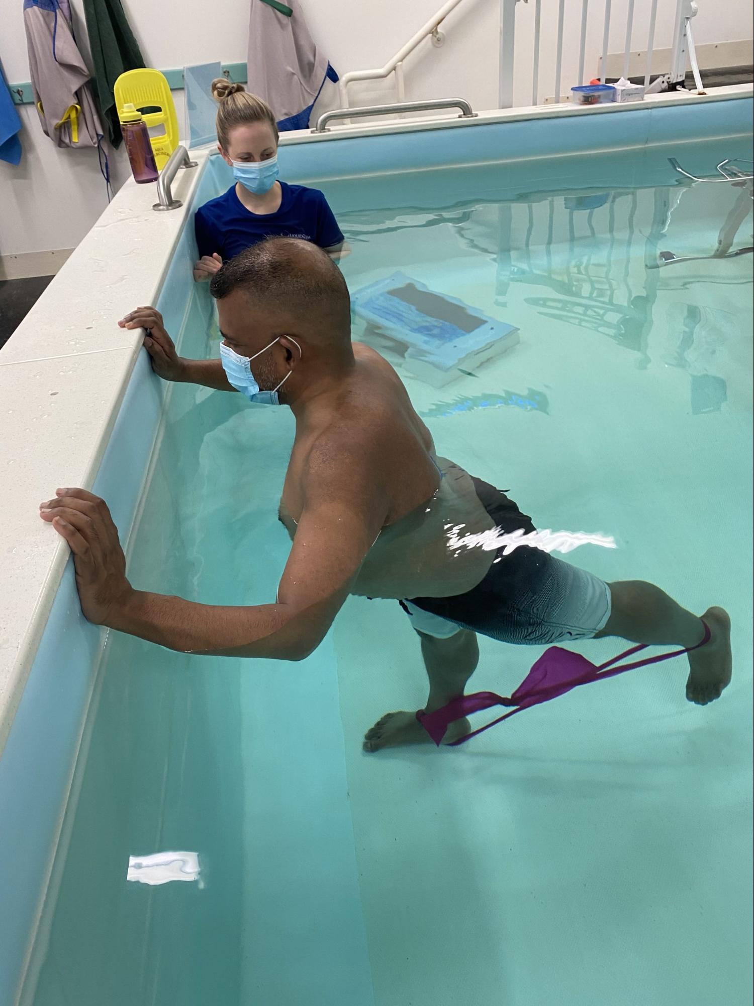 Resistance band exercise at the pool edge