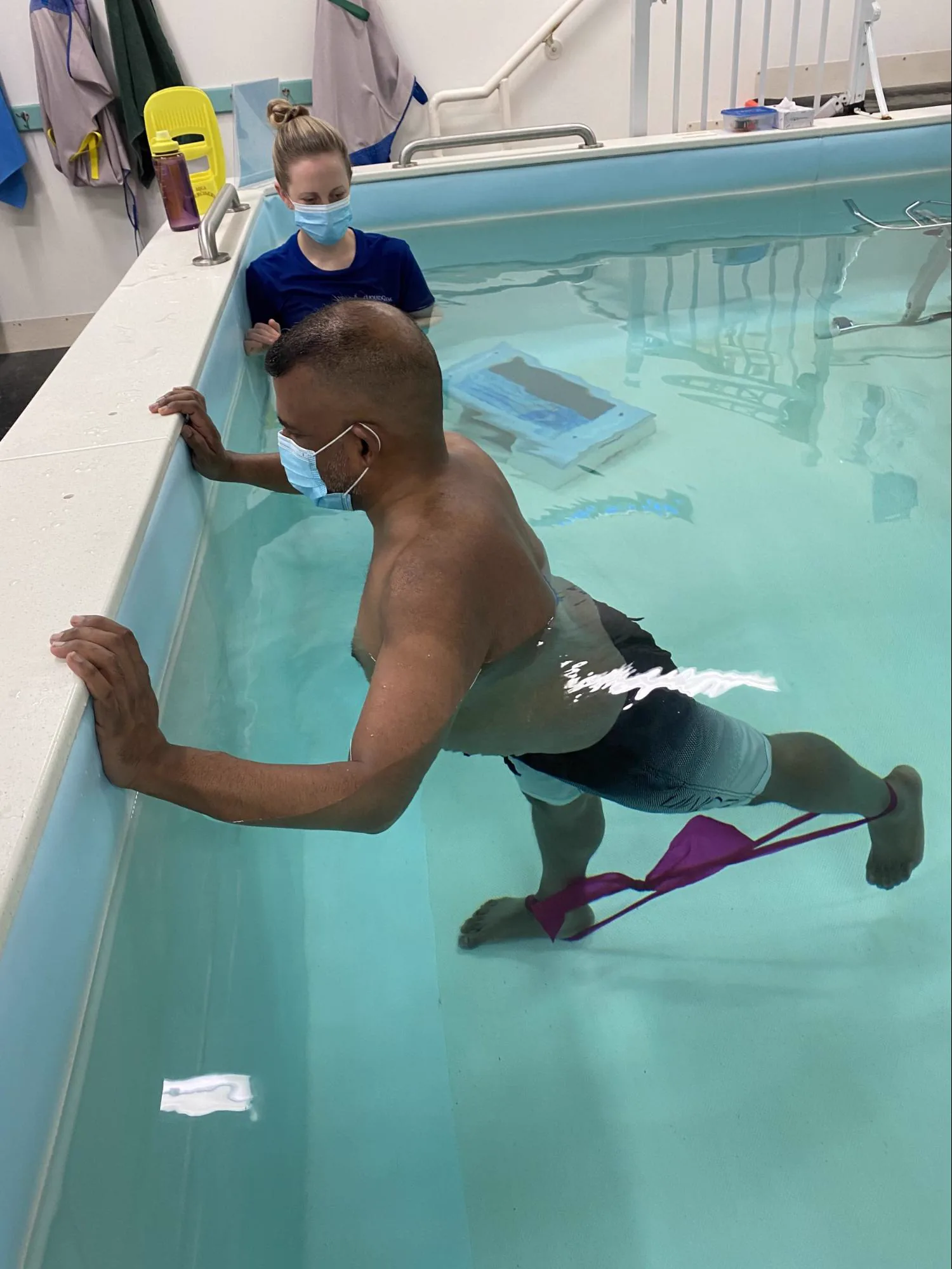 Resistance band exercise at the pool edge