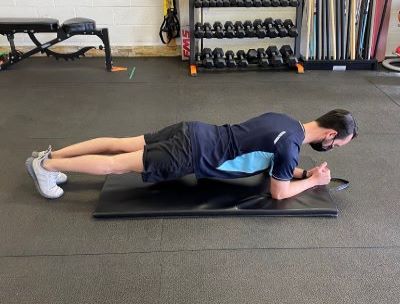 A plank variation during a core session