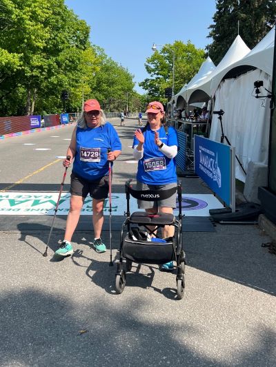 A participant with a walker on the course