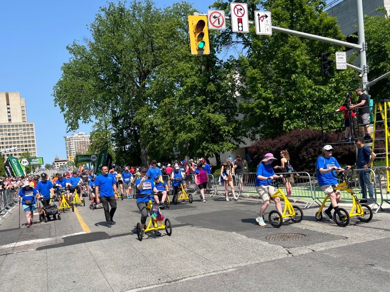 Riders making their way along the closed street