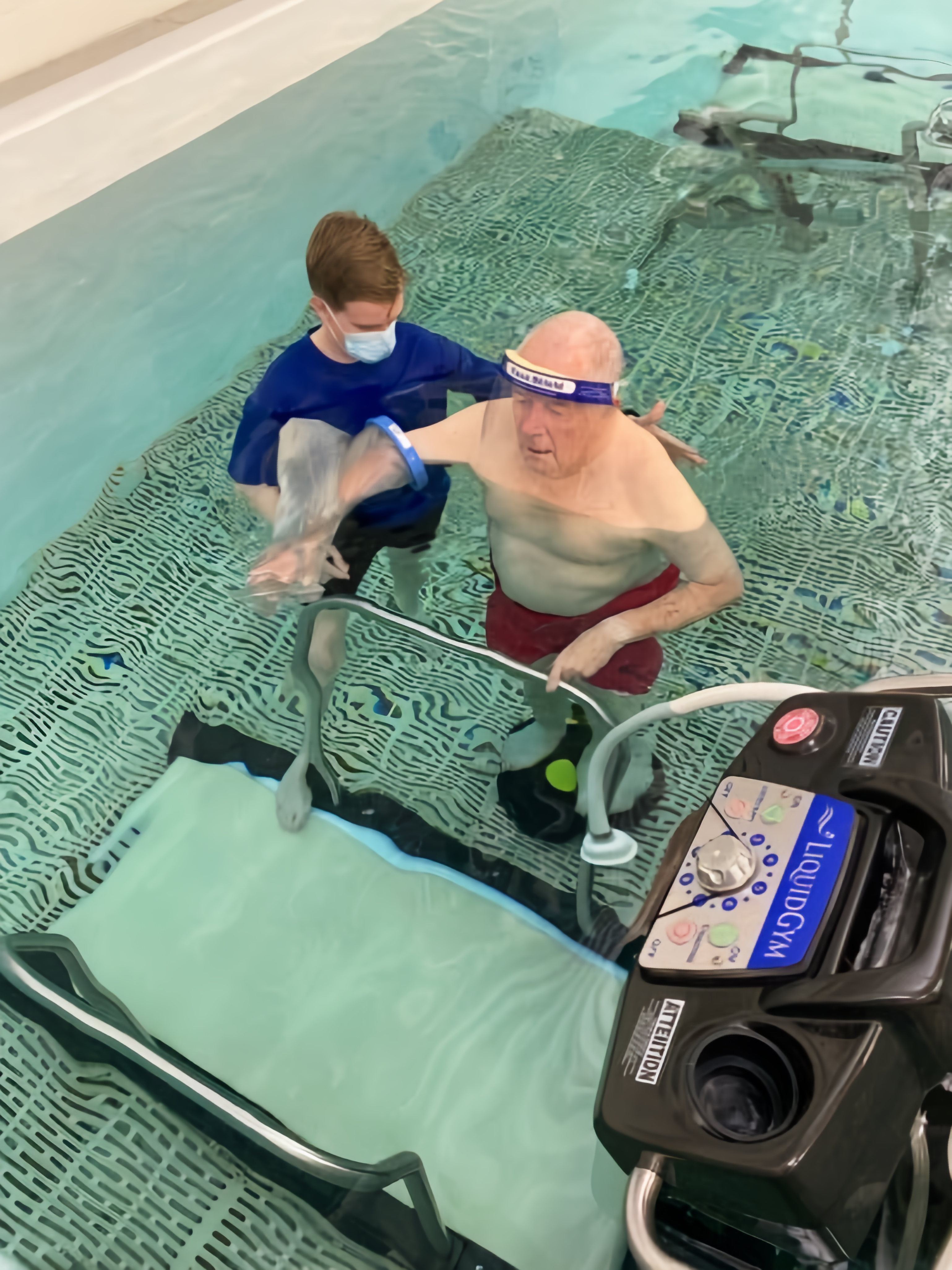 A LiquidGym clinician working with a patient