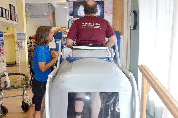 Anti-gravity treadmill session with a therapist
