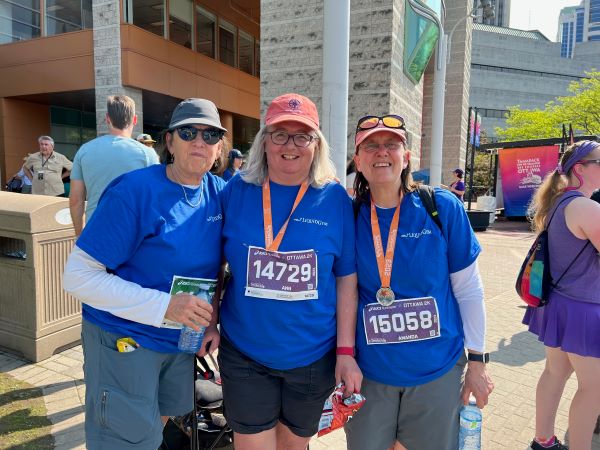 Three team members with their medals
