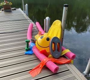 Aquatic exercise equipment laid out on a cottage dock