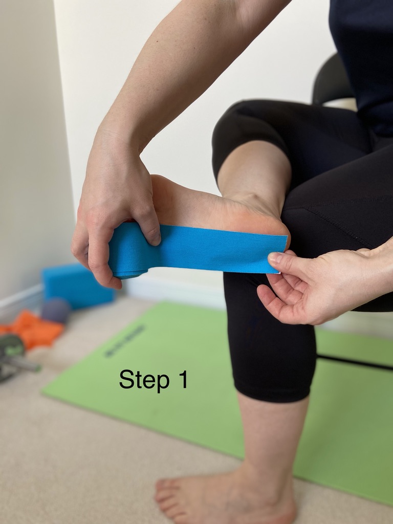 Measuring kinesiology tape from the heel to the ball of the foot