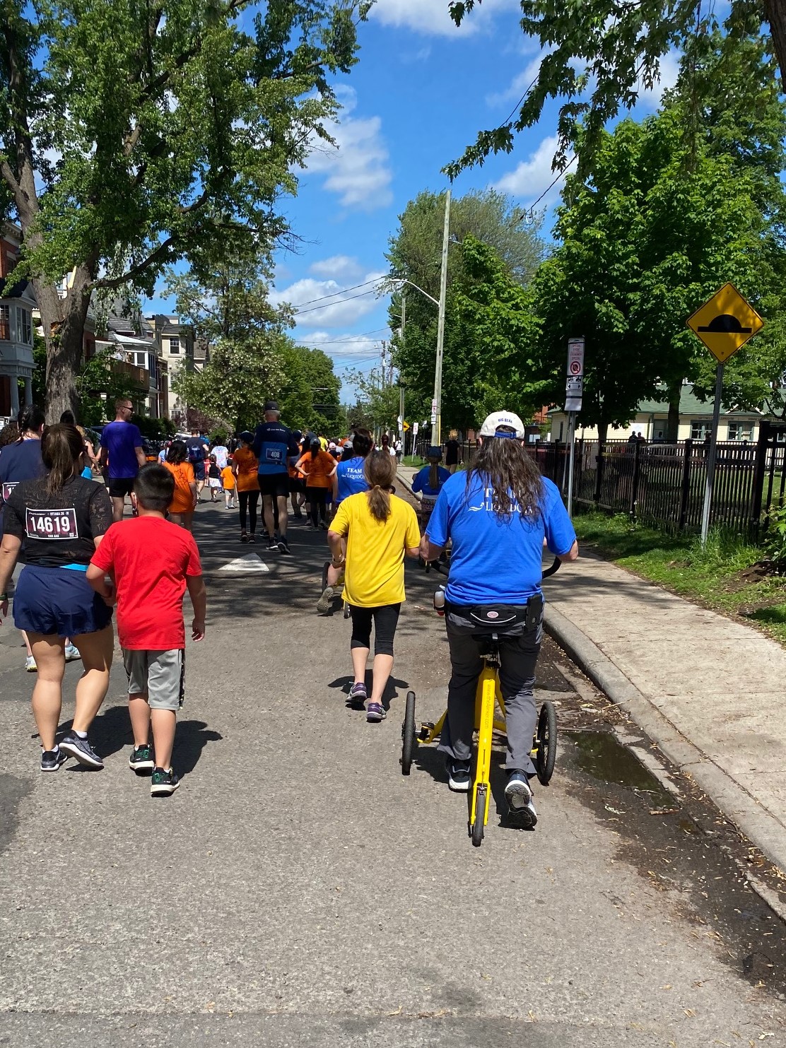 A participant riding an Alinker on the closed street